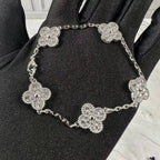 VCA Bracelet - Silver, pave clover bracelet held in hand