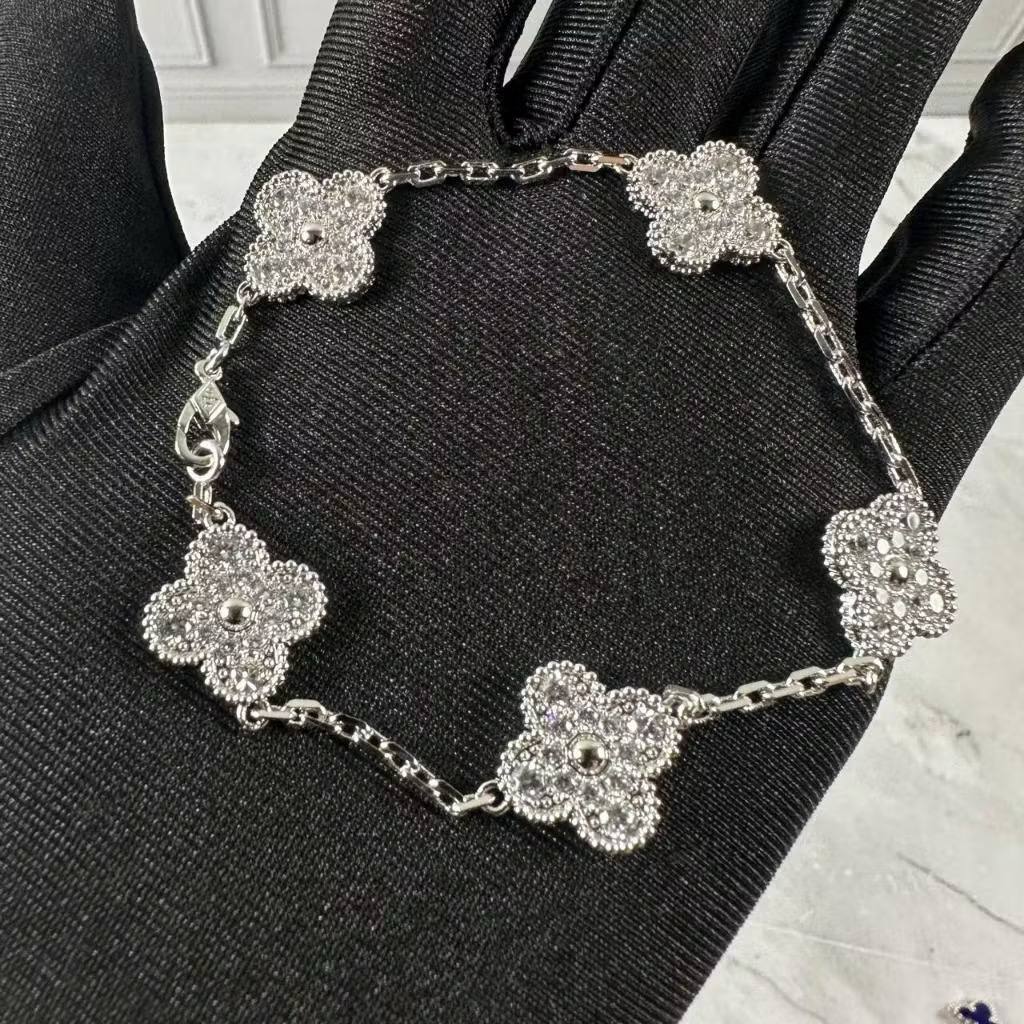 VCA Bracelet - Silver, pave clover bracelet held in hand