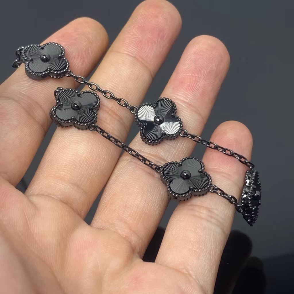 VCA Bracelet - Full Black, held in hand