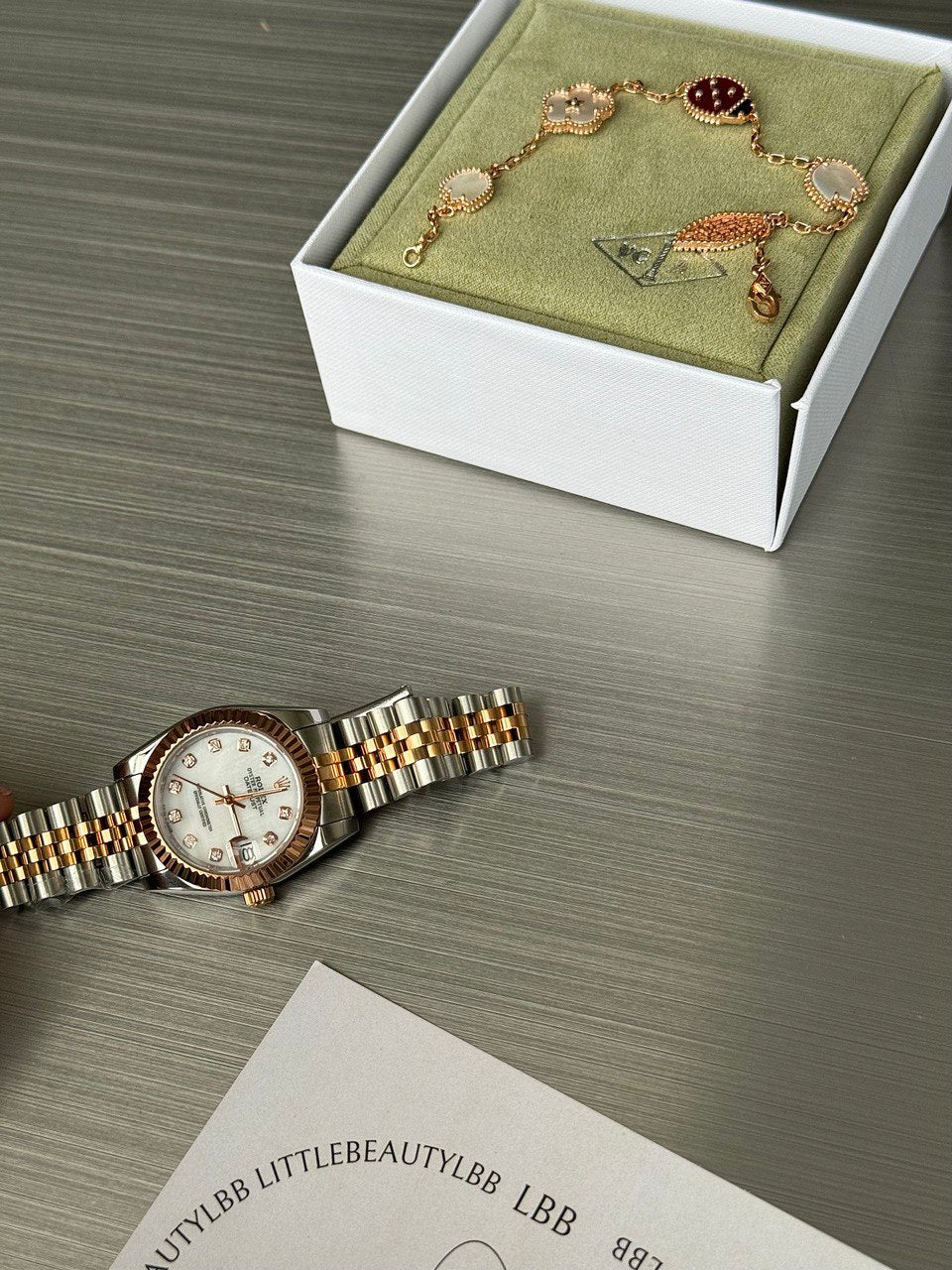 VCA Bracelet - Lady Bug, styled with a watch and gift box