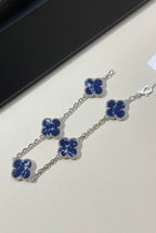 VCA Bracelet - blue stone clovers on silver, flat lay
